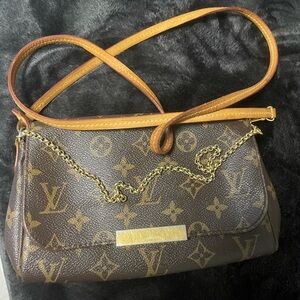 Authentic MM monogram clutch